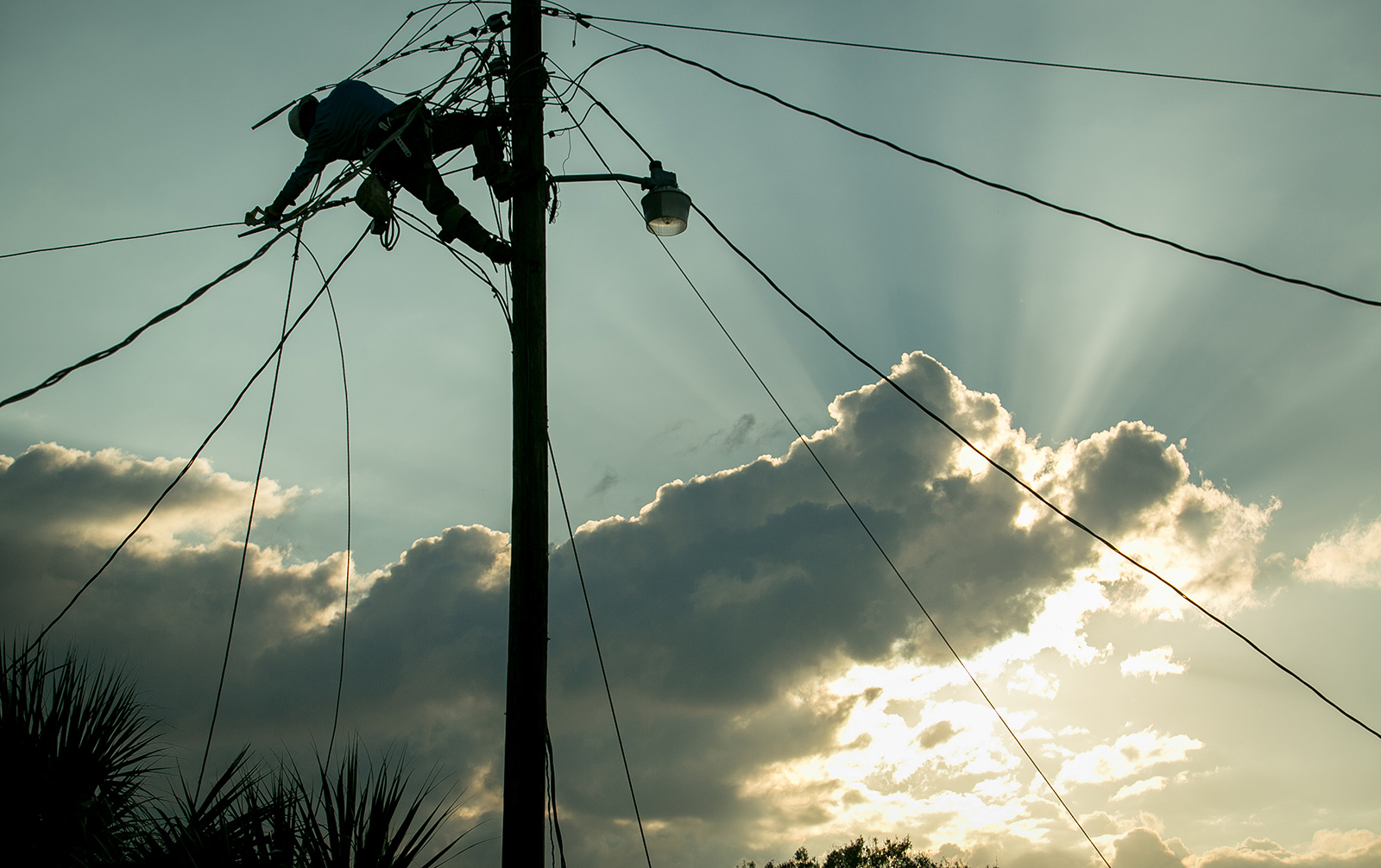 Lineworker at sunset