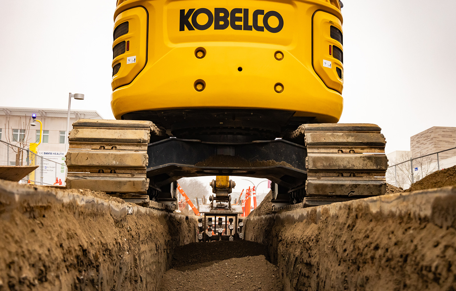 Excavator over trench